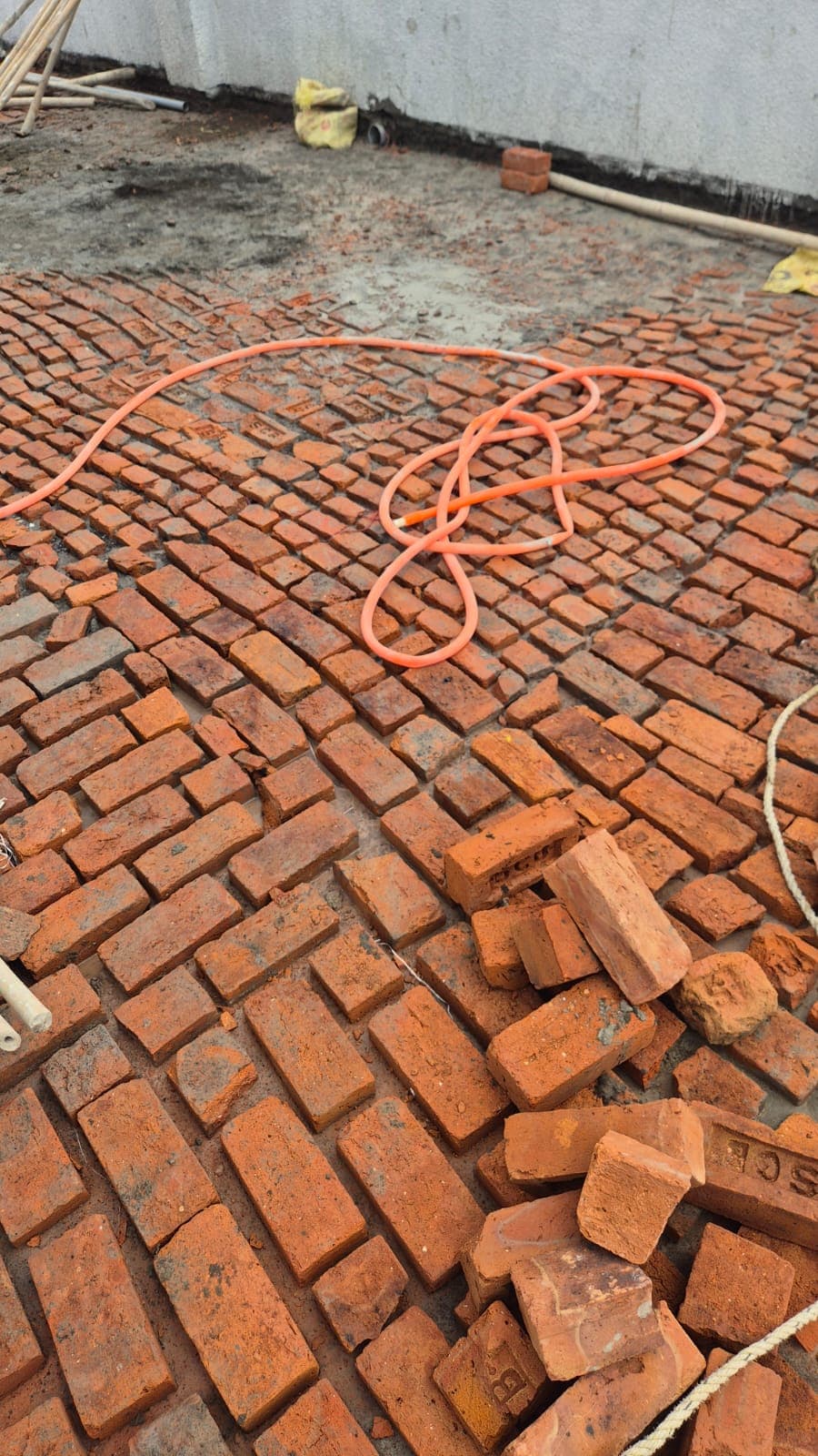 Terrace brick bat coba work advancing steadily